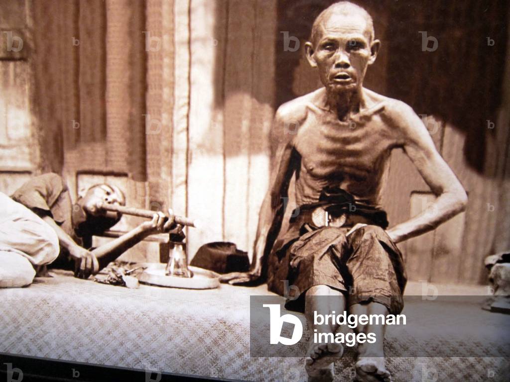 Singapore: Two opium smokers, c. 1910.