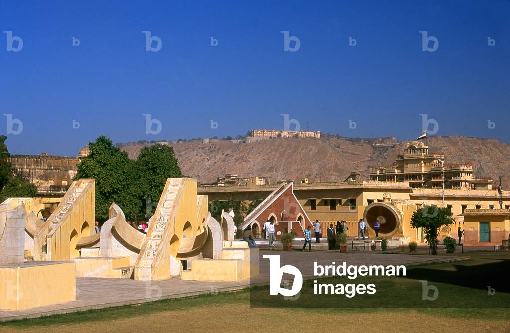India: The Jantar Mantar, Maharaja Sawai Jai Singh's 1728 astronomical observatory, (the Nahargarh Fort stands atop the hill in the background), Jaipur, Rajasthan