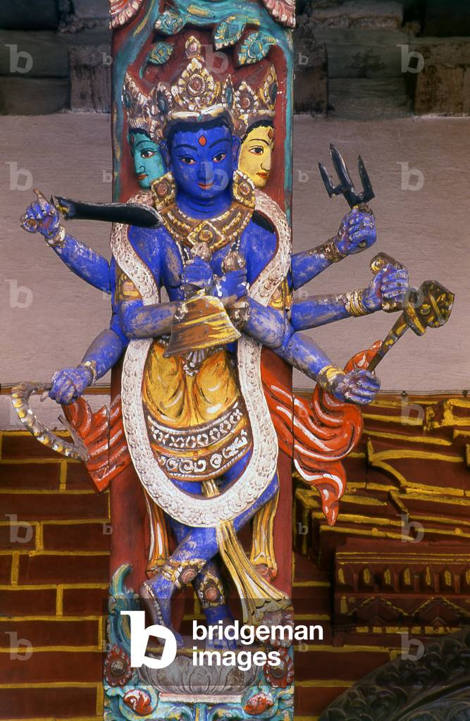 Nepal: A depiction of Shiva on a carved temple roof strut at the Buddhist Rudra Varna Mahavihar (Uku Bahal) temple, Patan, Kathmandu