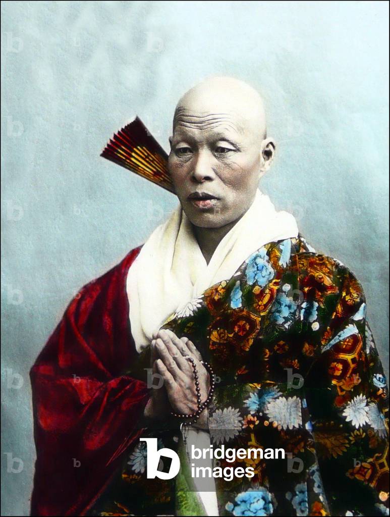 Japan: Buddhist monk in elaborate robes with fan and prayer beads, c.1900
