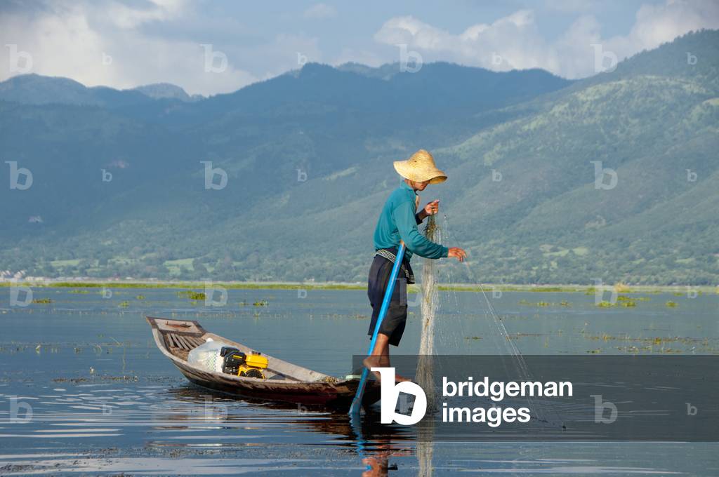 Burma / Myanmar: A leg rowing Intha fisherman on Inle Lake, Shan State