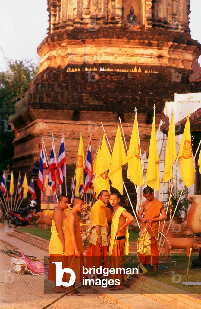Thailand: Monks unfurling flags for an upcoming festival, Chiang Mai, northern Thailand