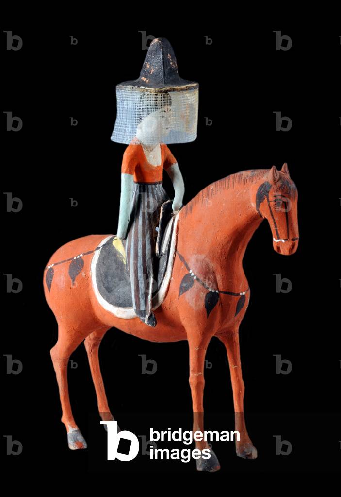 China: A veiled woman riding a richly caparisoned horse, Astana Tombs, Turpan Oasis, Xinjiang, 7th-8th century CE