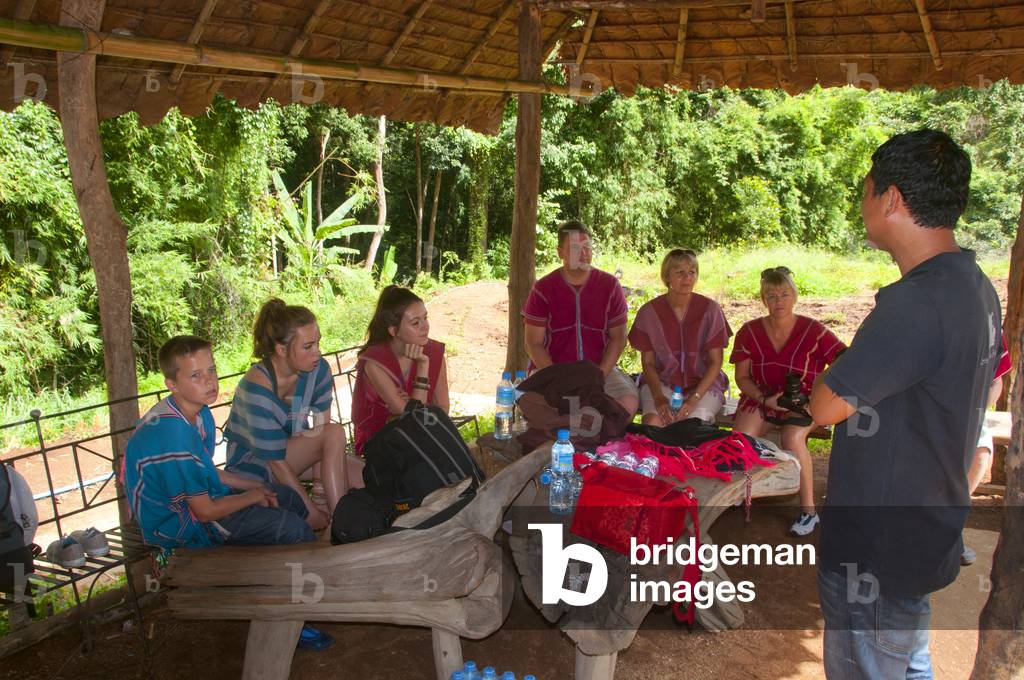 Thailand: Two families get final instructions before making friends with the elephants, Patara Elephant Farm, Chiang Mai Province