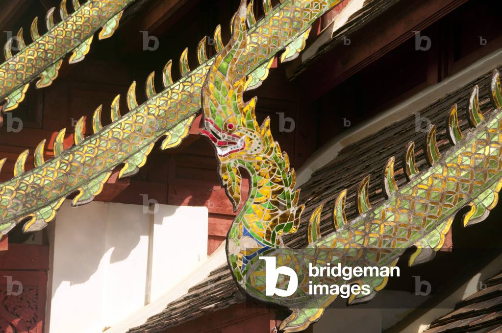 Thailand: Cho fa (sky hook) styled like a naga (mythical snake) at the end of a decorated  bargeboard, viharn, Wat Phrathat Doi Kham, Chiang Mai