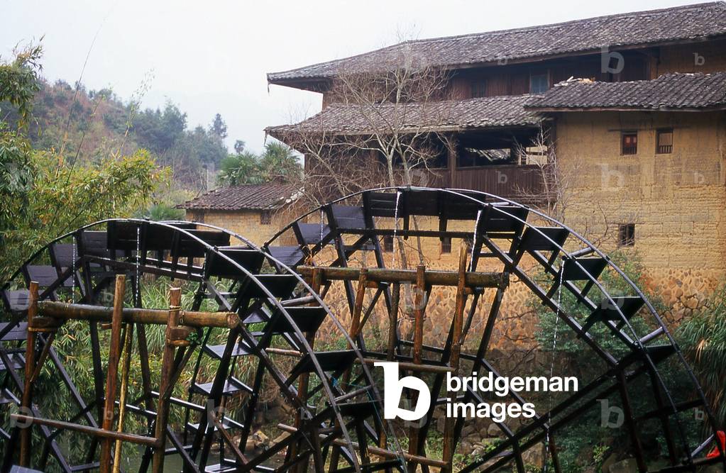 China: Waterwheels serving the Hakka earth houses near Hukeng, Yongding County, Fujian Province