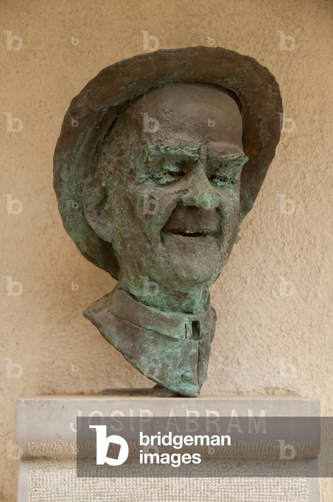 Slovenia: Josip Abram Trentar (Joze Abram, 1875 - 1938), Slovenian Roman Catholic priest, writer, playwright and translator. Sculpture outside a house in the Slovenian village of Stanjel which overlooks the Vipava Valley