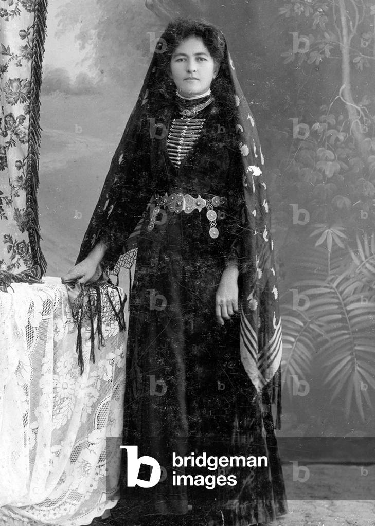 Middle East / Causcasus: Adyghe or Circassian woman in traditional dress, c. 1920