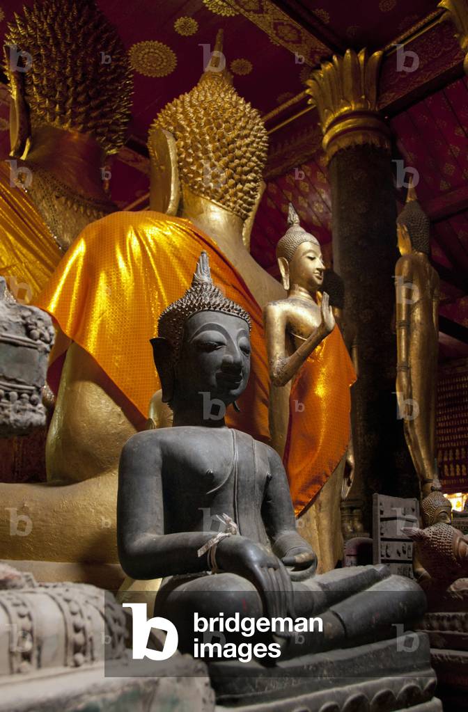 Laos: A small Buddha image behind the main Buddha image in the sim (ordination hall), Wat Mai Suwannaphumaham, Luang Prabang