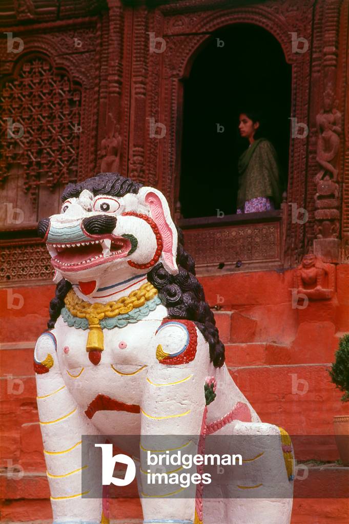 Nepal: Mythological lion guarding the entrance to the Shiva Parvati Temple, Durbar Square, Kathmandu