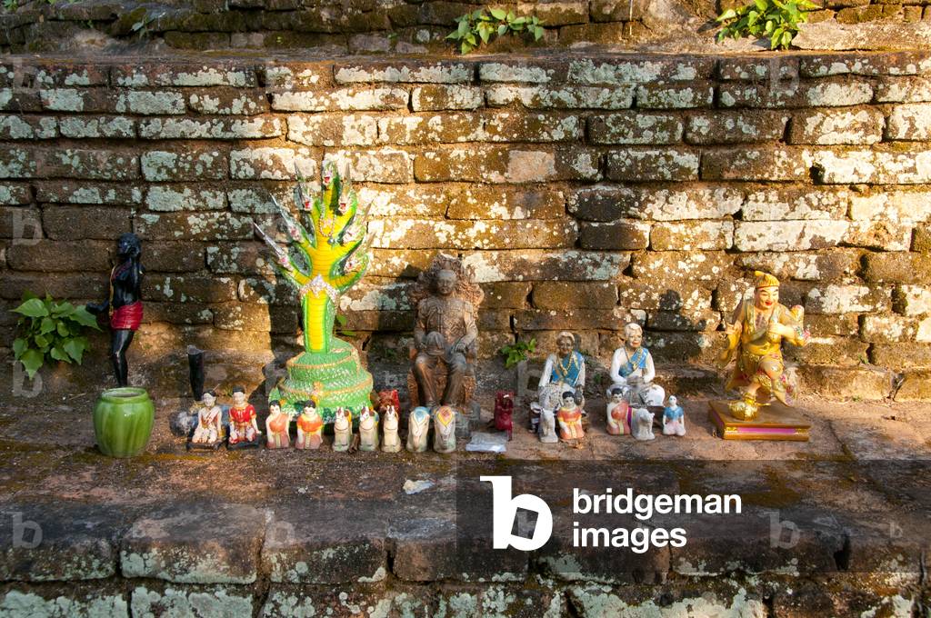 Thailand: A selection of statues including Thai King Chulalongkorn (Rama V) placed at the base of Chedi Plong by devotees, Wat Chiang Chom (Wat Chedi Plong), Chiang Mai