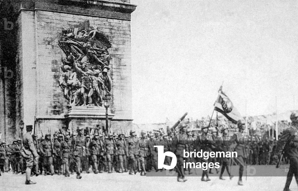France: Siamese (Thai) troops march through the Arc de Triomphe in Paris in a victory celebration after the end of World War I, 19 July, 1919 (b/w photo)