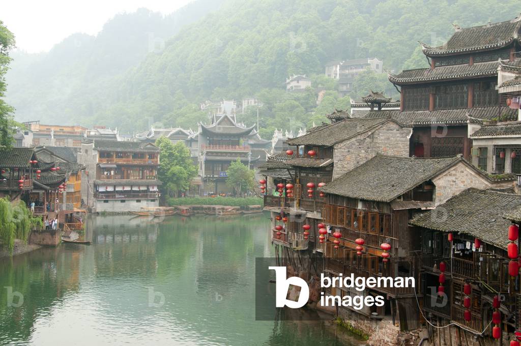 China: Early morning on Fenghuang's misty Tuo River, Hunan Province