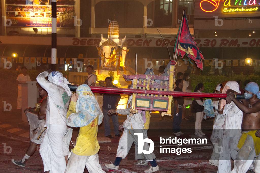 Thailand: Shrine bearers race through the streets in the night parade, Phuket Vegetarian Festival