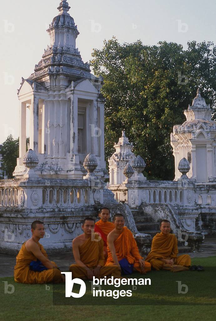 Thailand: Monks resting in the evening light, Wat Suan Dok, Chiang Mai, northern Thailand
