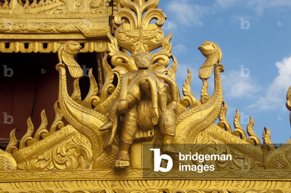 Burma / Myanmar: Woodcarving of a figure holding a woman's body, roof detail, Shwezigon Pagoda, Bagan (Pagan) Ancient City