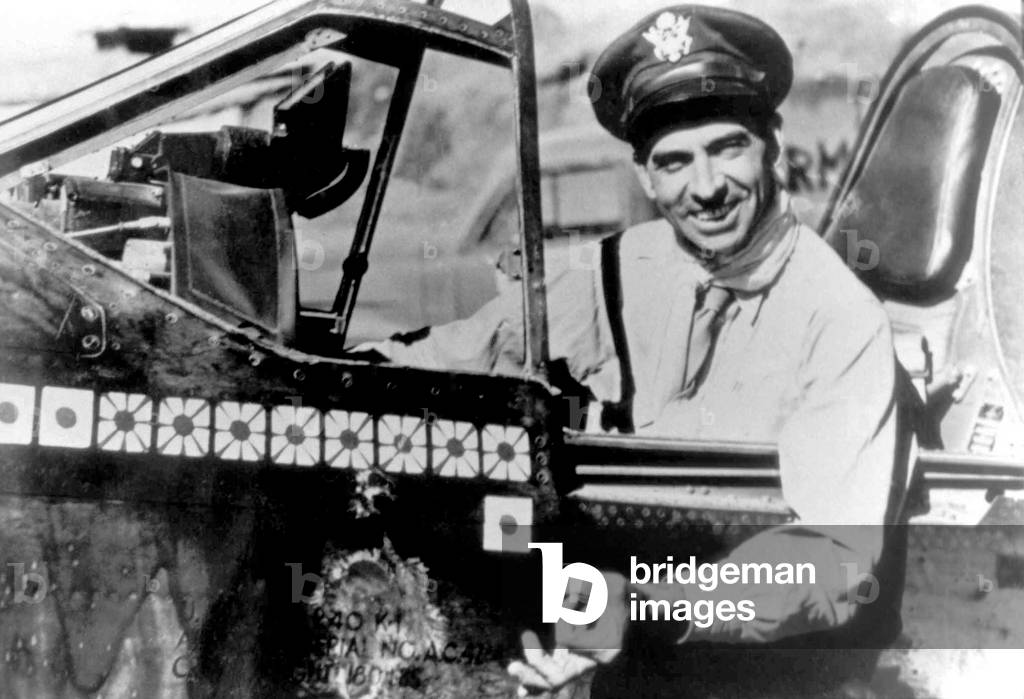 China: Flying Tiger pilot and brigadier general in the United States Air Force Robert Lee Scott Jr. (1908-2006), seated in his Curtiss P-40 Warhawk, Kunming, 1943