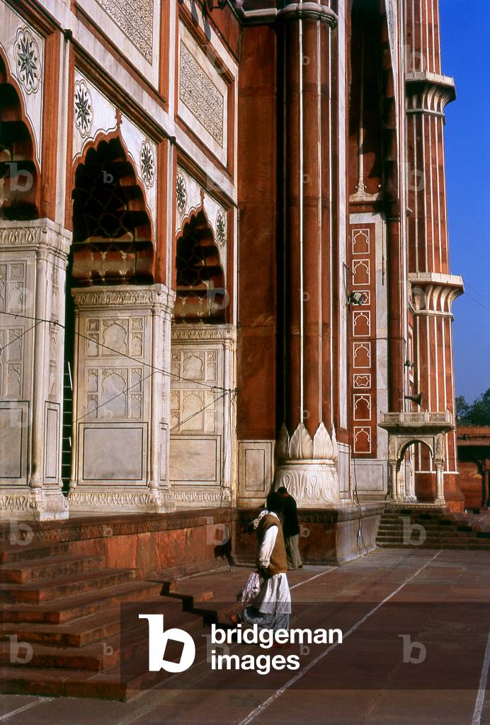 India: A man leaves the main hall after his early morning prayers, the Jama Masjid, India's largest mosque, Delhi