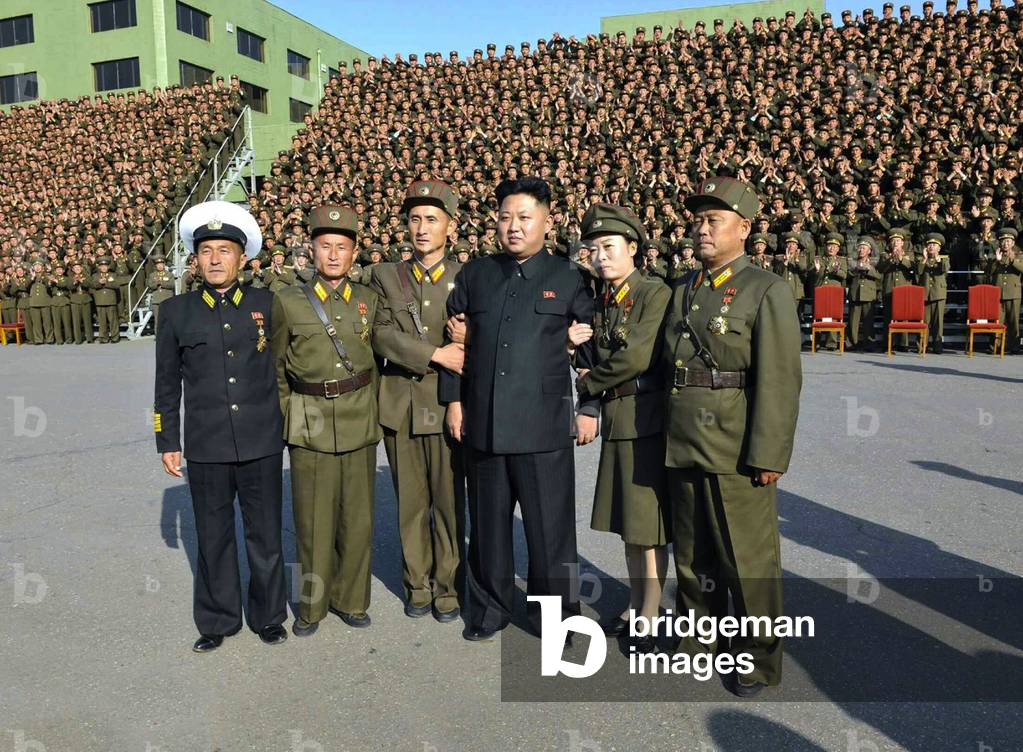 North Korea: Kim Jong Un (4th L) poses for a commemorative photo in Pyongyang on 23 October 2013 with participants in the 4th Meeting of KPA Company Commanders and Political Instructors