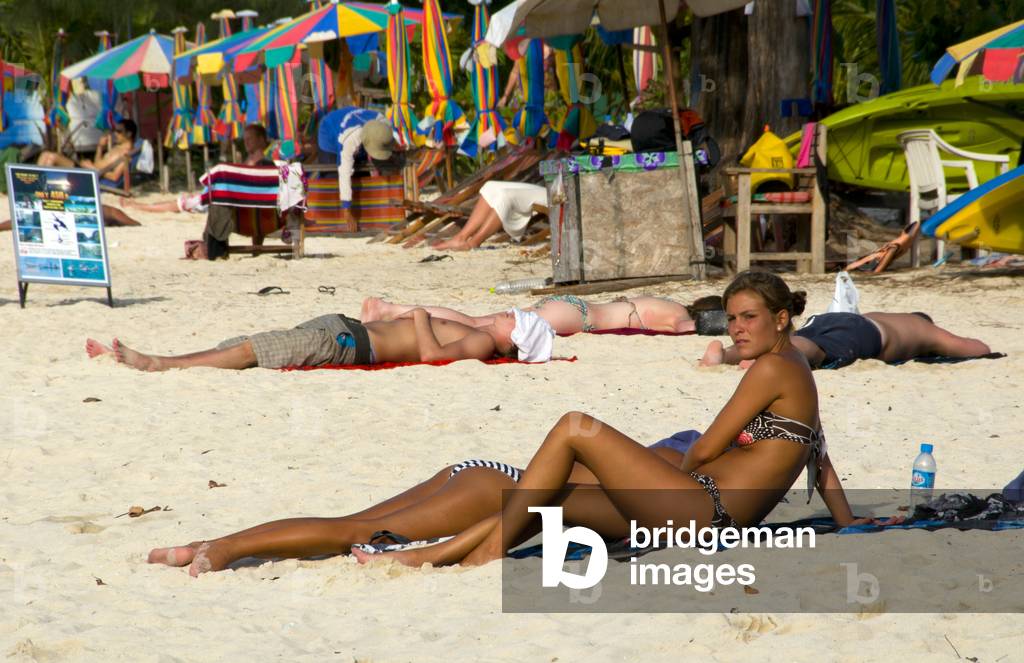 Thailand: Sunbathers, Ao Lo Dalum (Lo Dalum Bay), Ko Phi Phi Don, Ko Phi Phi