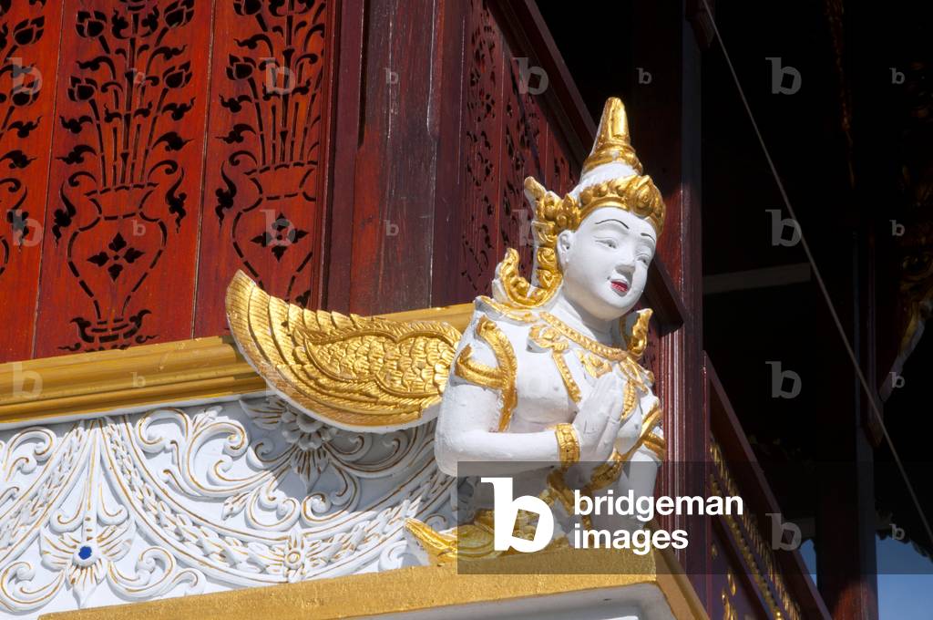 Thailand: Sculpture of a thewada (angel) on the Ho Trai or library building, Wat Changkam, Wiang Kum Kam, Chiang Mai