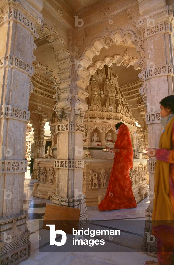 India: A pilgrim in one of the holy Jain Palitana temples (11th to 16th Century CE) in the Shatrunjaya Hills, Gujarat (2004)