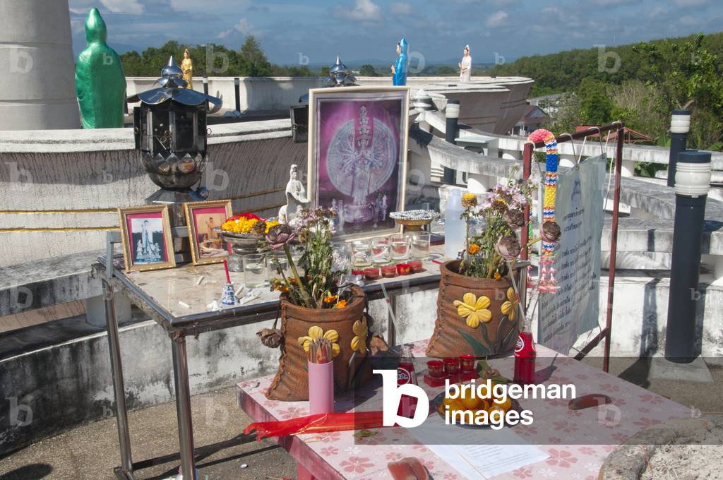 Thailand: Shrine in front of the Goddess Kuan Yin statue overlooking the town above Wat Matchimaphum, Trang Town, Trang Province, southern Thailand