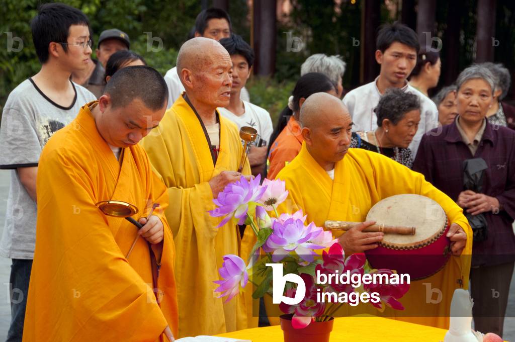 China: Elaborate late afternoon Buddhist rituals outside Ming-era Qianming Si (Qianming Temple), Guiyang, Guizhou Province
