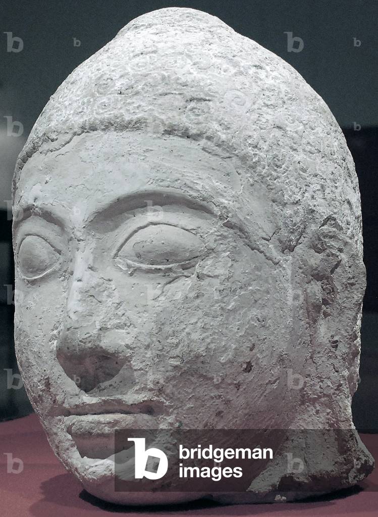 Maldives: Head of a Buddha image discovered on Thoddoo Island, Northern Ari Atoll, by Muhammad Ismail Didi, c. 1955, and subsequently destroyed by Muslim iconoclasts at Male Museum, February 2012. c. 9th century CE (photo)