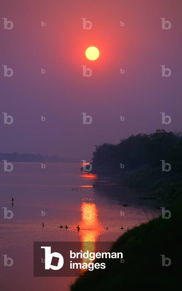 Laos: Swimmers in the Mekong River at sunset, Vientiane