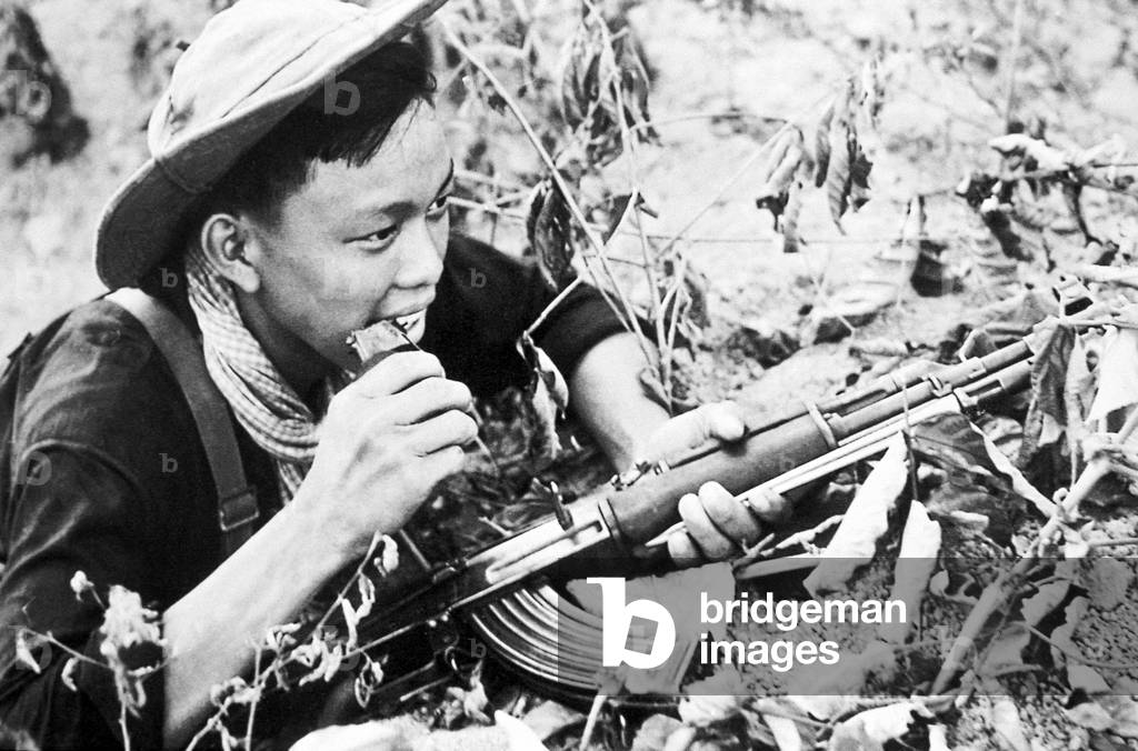 Vietnam: NLF (Viet Cong) soldier with AK47 assault rifle near Saigon, 1968
