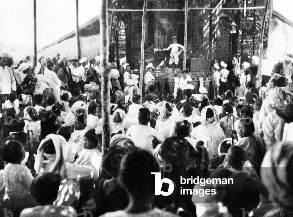 Burma/ Myanmar: A troupe of young performers entertains locals at a makeshift theatre in Pekon, Taunggyi District, Shan State, c.1920s.