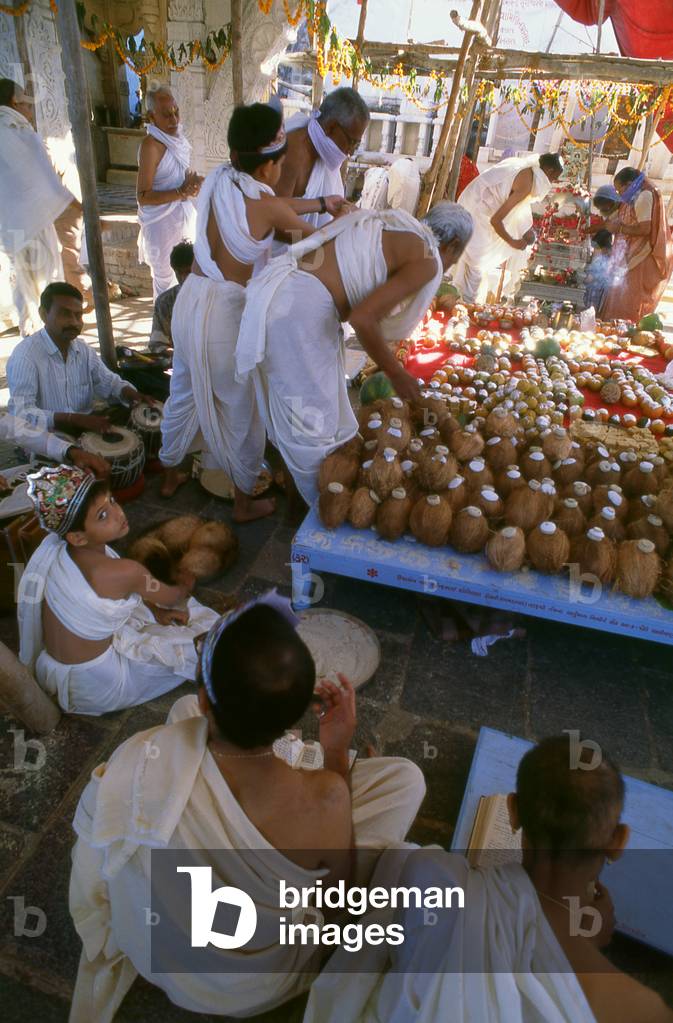 India: Coconuts, some with coins attached, are used as offerings in the holy Jain Palitana temples (11th to 16th Century CE) in the Shatrunjaya Hills, Gujarat (2004)
