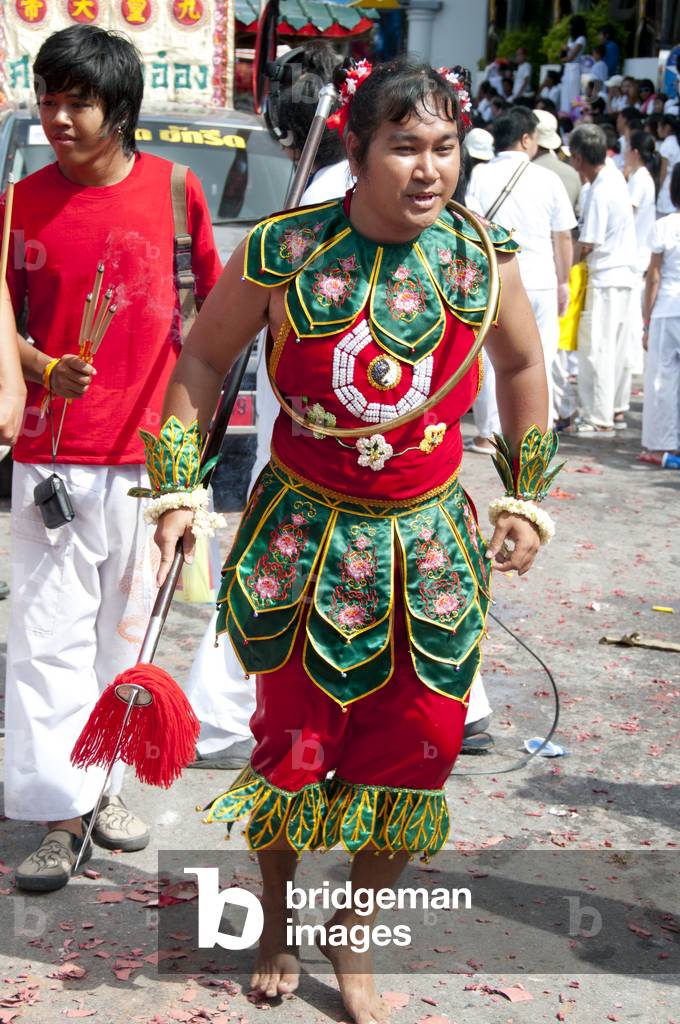 Thailand: Entranced devotee or 'Ma Song' takes part in a procession through Phuket Town, Phuket Vegetarian Festival