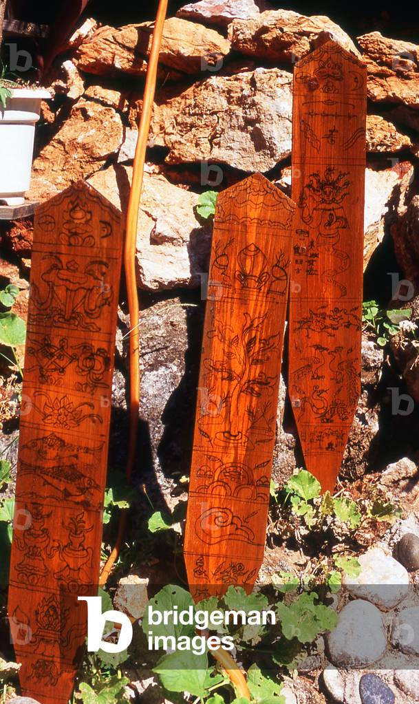 China: Naxi (Dongba) pictograms in the garden at the Dongba Cultural Research Institute, Lijiang, Yunnan Province