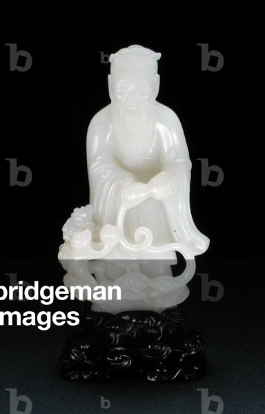 Dong-Fang Shuo standing emptying his gourd from which emerges lingzhi clouds, a kneeling monkey offering a peach at his feet, Kangxi period (1662-1722) (white stone)