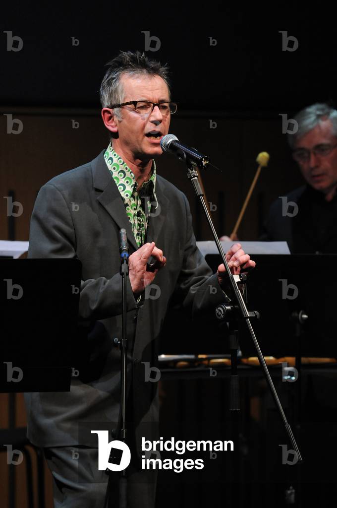 Poet John Hegley performing
