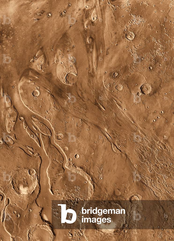 Ancient channels on Mars - Ancient channels on planet Mars. Ares Vallis - View of the area of Ares Vallis and Tiu Vallis obtained by the probe 2001 Mars Odyssey. This region seems to have been shaped by the passage of water. Channels scoured by ancient outbursts of flood waters are seen in this orbital view from Odyssey's Thermal Emission Imaging System.The channels are billions of years old and have likely been affected by multiple processes over time. Here, two channels, Tiu Vallis on the left and Ares Vallis on the right, flow northward from the highlands of the southern hemisphere of Mars.The stark difference between today's cold, dry Mars and the evidence of flood waters in the past tells scientists that the Martian climate has seen great changes
