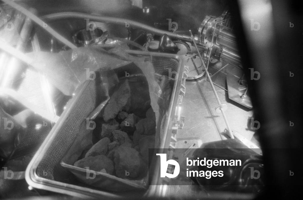 Apollo 11: lunar rock - Apollo 11: lunar rock - Close up of lunar rocks contained in the first container of samples brought by astronauts from the Apollo 11 mission. 26 July 1969. A close - up view of the lunar rocks contained in the first Apollo 11 sample return container. The rock box was opened for the first time in the Vacuum Laboratory of the Manned Spacecraft Center's Lunar Receiving Laboratory, Building 37, at 3:55 p.m. (CDT), Saturday, July 26, 1969. The gloved hand gives an indication of size. This box also contained the Solar Wind Composition experiment (not shown) and two core tubes for subsurface samples (not shown). These lunar samples were collected by astronauts Neil A. Armstrong and Edwin E. Aldrin Jr. during their lunar surface extravehicular activity on July 20, 1969. 26 July 1969