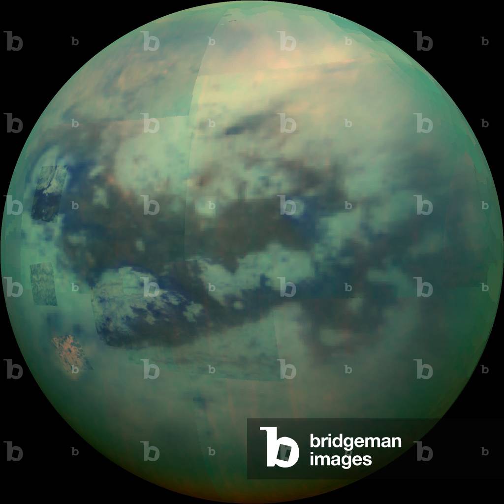 Titan, Saturn satellite seen by Cassini - Saturn's moon Titan as seen by Cassini spacecraft: Visible and infrared composite image of Titan taken by the Cassini probe on November 13, 2015. View of the hemisphere oriente towards Saturn - This composite image shows an infrared view of Saturn's moon Titan from Nasa's Cassini spacecraft, acquired during the mission's “” T-114”” flyby on Nov. 13, 2015. The spacecraft's visual and infrared mapping spectrometer (VIMS) instrument made these observations, in which blue represents wavelengths centered at 1.3 microns, green represents 2.0 microns, and red represents 5.0 microns. A view at visible wavelengths (centered around 0.5 microns) would show only Titan's hazy atmosphere (as in PIA14909). The near-infrared wavelengths in this image allow Cassini's vision to penetrate the haze and reveal the moon's surface - During this Titan flyby, the spacecraft's close-approach altitude was 6,200 miles (10,000 kilometers), which is considerably higher than those of typical flybys, which are around 750 miles (1,200 kilometers). The high flyby allowed VIMS to gather moderate-resolution views over wide areas (typically at a few kilometers per pixel) - The view looks toward terrain that is mostly on the Saturn-facing hemisphere of Titan. The scene features the parallel, dark, dune-filled regions named Fensal (to the north) and Aztlan (to the south), which form the shape of a sideways letter “” H.””” - Several places on the image show the surface at higher resolution than elsewhere. These areas, called subframes, show more detail because they were acquired near closest approach. They have finer resolution, but cover smaller areas than data obtained when Cassini was farther away from Titan - Near the limb at left, above center, is the best VIMS view so far of Titan's largest confirmed impact crater, Menrva. Similarly detailed subframes show eastern Xanadu, the basin Hotei Regio, and channels within bright terrains east of Xanadu. - Due to the