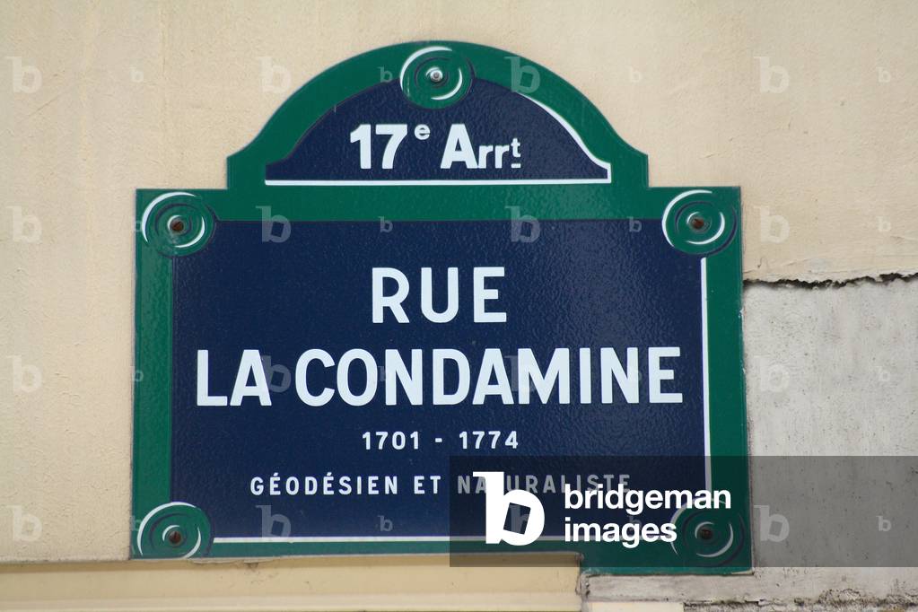 Plaque de la rue La Condamine in Paris - Street Plaque in Paris - Rue du XVIII arrondissement de Paris, in tribute to Charles Marie de La Condamine (1701 - 1774), geodesian and naturalist. He was sent to Peru in 1735 by the Academy of Sciences to determine the length of a 1* Meridian arc on Ecuador, in order to determine whether the Earth is flattened to the Poles or to Ecuador (in comparison with Clairaut and Maupertuis's work in Lapland). Rue La Condamine, street sign. Charles Marie de La Condamine (January 28, 1701 - February 13, 1774) was a French explorer, geographer, and mathematician