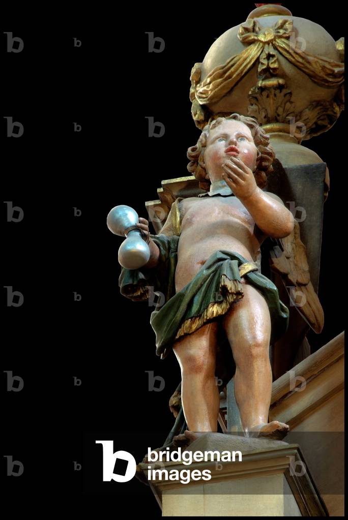 Astronomical clock of the 16th century - Detail - Lyon - Astronomical clock - 16th century - Lyon - France - 69 - Lyon - Cathedrale Saint Jean Baptiste. Detail of the astronomical clock 16th century: polychrome wood sculpture, angel automaton of the top of the clock carrying an hourglass. One of the automatons, an angel with an hourglass. Detail of Astronomical clock - 16th century by Hugues Levet. Saint Jean Baptiste cathedral, Lyon, France