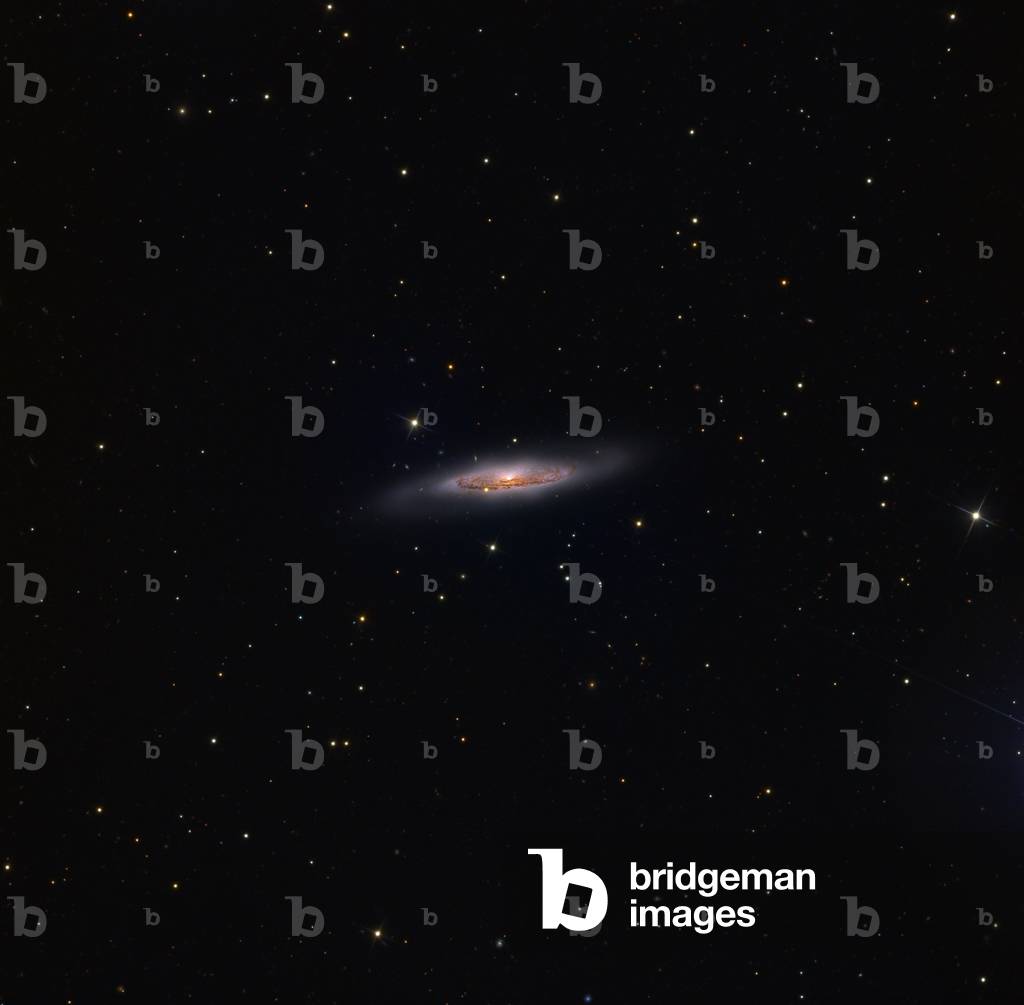 Spiral galaxy NGC 4910 - Spiral galaxy NGC 4910 in the constellation Virginis. Spiral galaxy NGC 4910 in Virgo