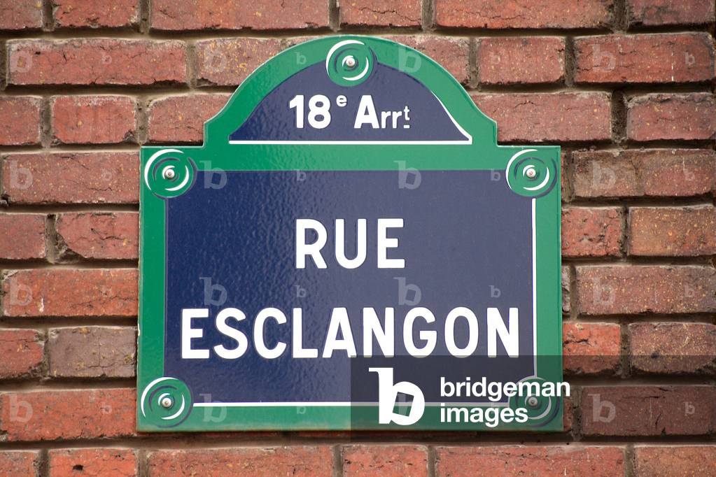 Plaque de la rue Esclangon a Paris - Street Plaque in Paris - Rue du XVIIIème arrondissement de Paris, in tribute to Ernest Benjamin Esclangon, astronomer and physicist (1876 - 1954) First astronomer at the Observatoire de Bordeaux (1899), Esclangon was then Director of the Observatory of Strasbourg (1918 - 1929), before becoming Director of the Observatory of Paris (1929 - 1944). Member of the Academy of Sciences in 1929, he joined the International Astronomical Union from 1935 to 1938. We owe him the invention of the talking clock. Street Esclangon, street sign. Benjamin Esclangon (1876 - 1954) was a french astronomer
