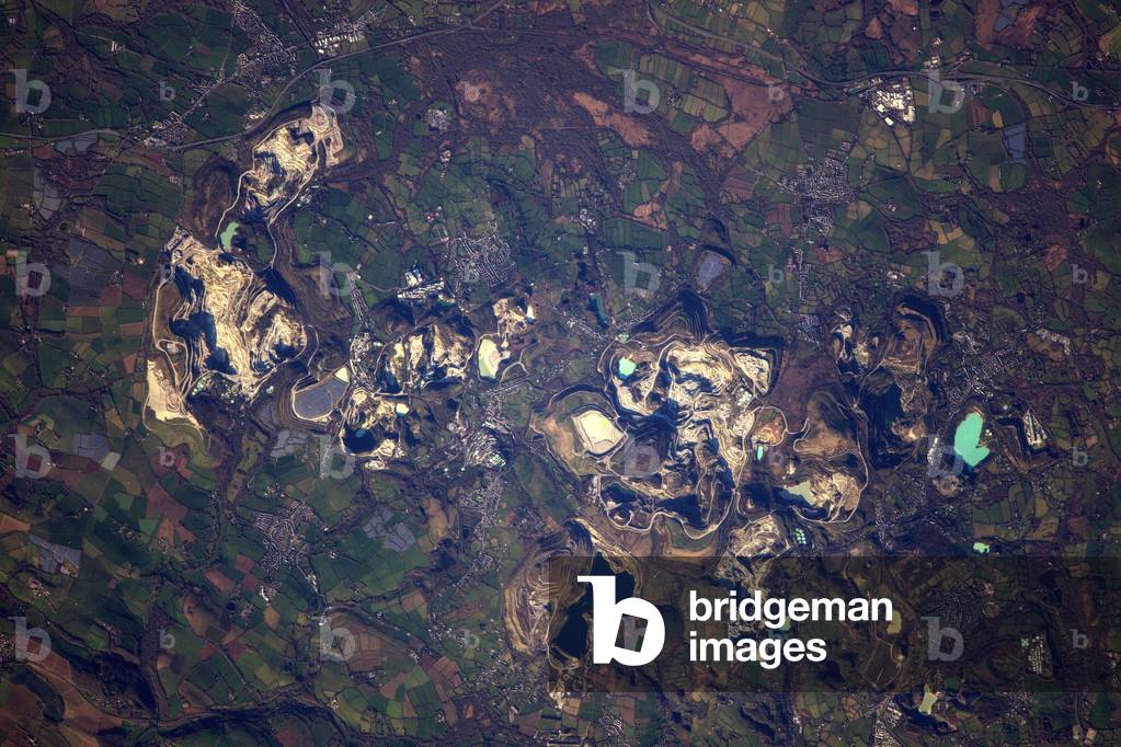 Kaolin quarries near St Austell - England - Clay mining operation near St Austell - Cornwall: Kaolin mining operation in Cornwall, England. Image taken from the International Space Station (ISS) on December 28, 2016. China clay pit in Cornwall seen from the international space station on December 28, 2016.