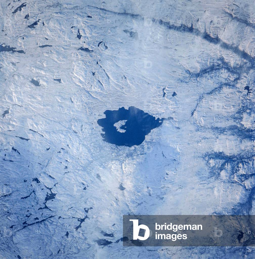 Mistastin Crater - Canada - Mistastin Impact Crater - Canada - Mistastin Impact Crater seen since the Space Shuttle Challenger in 1985. The Mistastin Crater is a meteoritic crater located in Canada in the Labrador region and contains circular lake Mistastin. Mistastin crater is a meteorite crater in Labrador, Canada which contains the roughly circular Mistastin Lake
