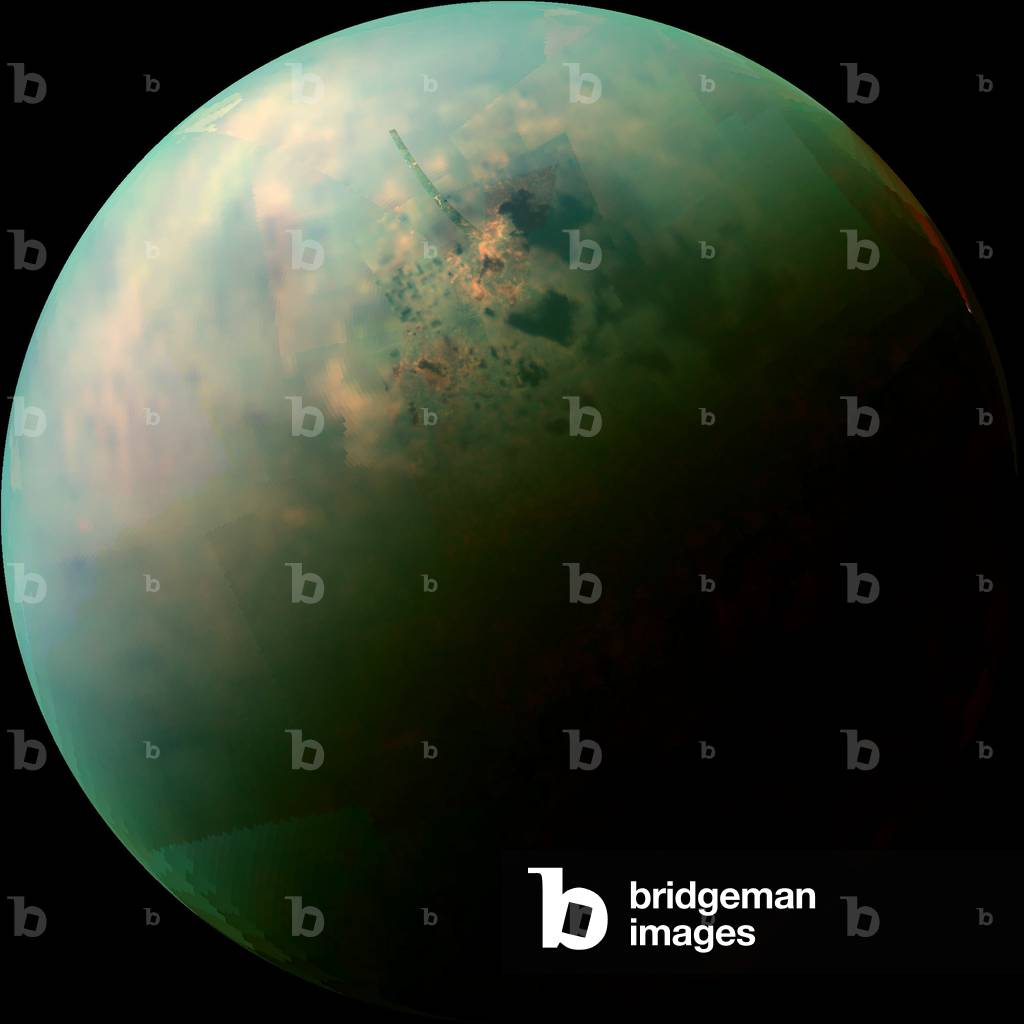 Titan, Saturn satellite seen by Cassini: Visible and infrared composite image of Titan taken by the Cassini probe on September 12, 2013. View of methane and ethane lakes. - This false-color mosaic, made from infrared data collected by Nasa's Cassini spacecraft, reveals the differences in the composition of surface materials around hydrocarbon lakes at Titan, Saturn's largest moon. Titan is the only other place in the solar system that we know has stable liquid on its surface, though its lakes are made of liquid ethane and methane rather than liquid water. While there is one large lake and a few smaller ones near Titan's south pole, almost all of Titan's lakes appear near the moon's north pole - Scientists mapped near-infrared colors onto the visible color spectrum. Red in this image was assigned a wavelength of 5 microns (10 times longer than visible light), green 2.0 microns (four times longer than visible light), and blue 1.3 microns (2.6 times longer than visible light) - The orange areas are thought to be evaporite - the Titan equivalent of salt flats on Earth. The evaporated material is thought to be organic chemicals originally from Titan's haze particles that once dissolved in liquid methane. They appear orange in this image against the greenish backdrop of Titan's typical bedrock of water ice - In this mosaic, Kraken Mare, which is Titan's largest sea and covers about the same area as Earth's Caspian Sea and Lake Superior combined, can be seen spreading out with many tendrils on the upper right,. The big dark zone up and left of Kraken is Ligeia Mare, the second largest sea. Below Ligeia, shaped similar to a sports fan's foam finger that points just up from left, is Punga Mare, the third largest Titan Sea. Numerous other smaller lakes dot the area. Titan's north pole is located in the geographic location just above the end of the “” finger”” of Punga Mare. The data shown here were obtained by Cassini's visual and infrared mapping spectrometer during