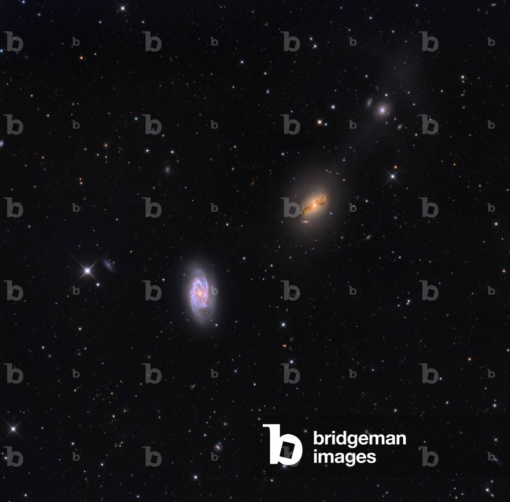 Galaxy NGC 2964 in the Lion - Galaxy NGC 2964 in Leo - NGC 2964 is a barred spiral galaxy located at a distance of about 71 million years - light. In the center of the image is the galaxy NGC 2968 and in the upper right is the galaxy NGC 2970. NGC 2964, a barred spiral galaxy in Leo. In the center of the image is galaxy NGC 2968 and top right is the galaxy NGC 2970