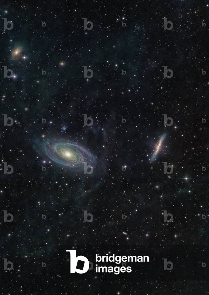 Galaxies M81 and M82 in the Great Bear - Galaxies M81 and M82 in Ursa Major: M81 (left) is a spiral galaxy. M82 (right) an irregular galaxy. Separate about 150,000 light years, these two galaxies belong to the galaxy cluster closest to our local group. These galaxies are approximately 12 million light years away from Earth. - M81, seen here at left, is a grand design spiral galaxy that forms a physical pair with irregular galaxy M82. They are separated by 150,000 light years at a distance of 12 million light years