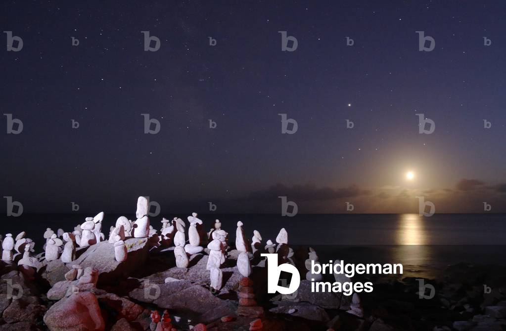 Sunrise - Moonrise - Sunrise from a crescent of the Moon on the sea. The planet Jupiter is visible above it. Brittany, 17 September 2007. Moon crescent is rising above the sea. Above it, the bright planet Jupiter. September 17 2007 in Brittany, France